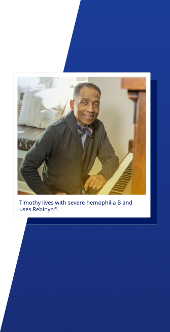 A man named Timothy sits at the piano and smiles.